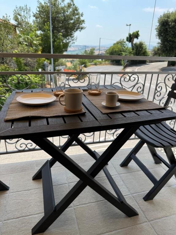 Balcony of the Monti apartment overlooking the hills